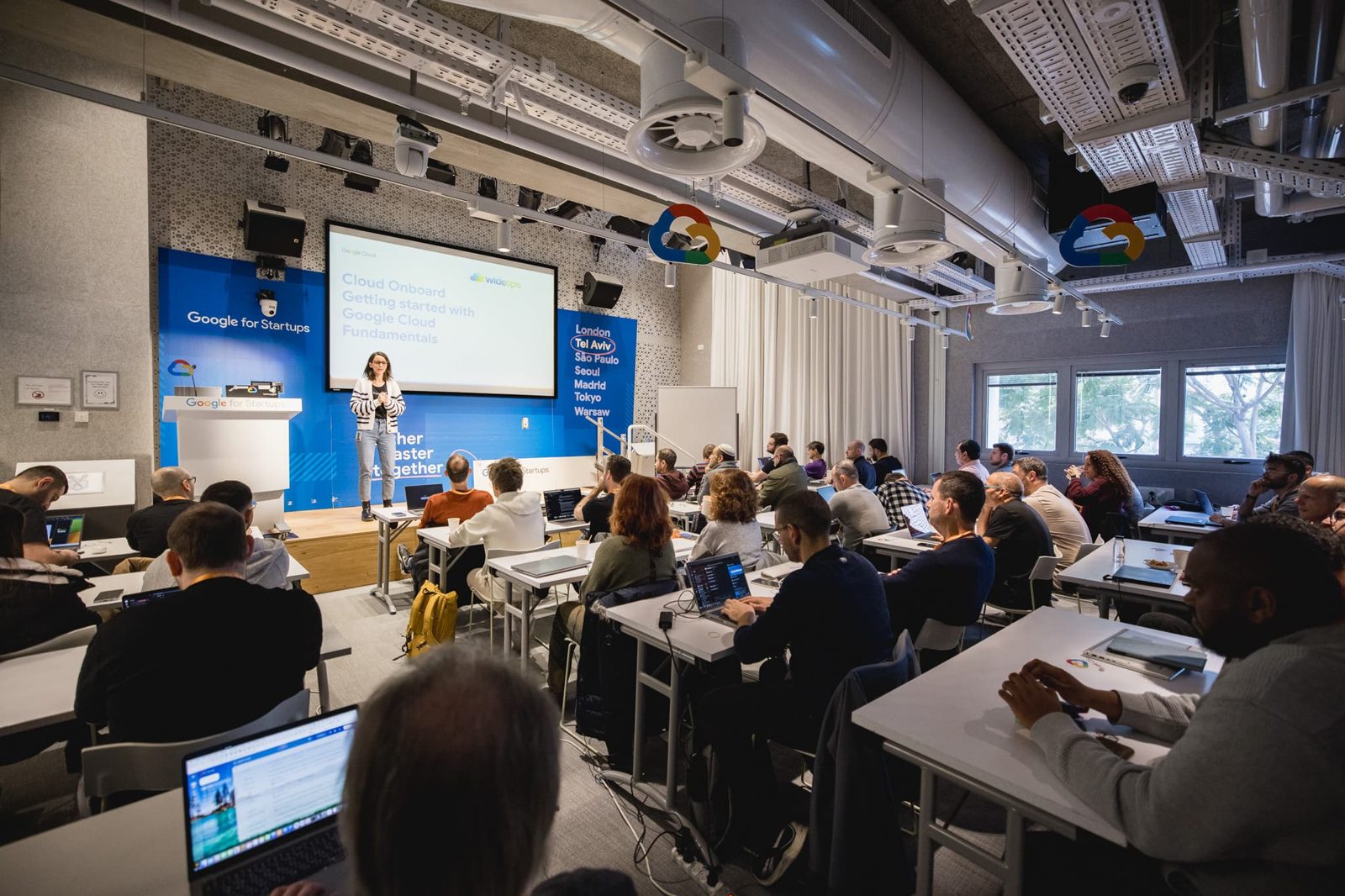 Attendees at a WideOps Google Cloud workshop hosted in a Google office